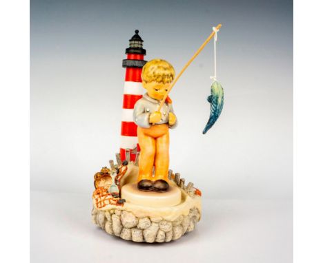Hand painted in matte finish, molded as a little boy fishing by the shore. M. I. Hummel impressed backstamp. Goebel backstamp