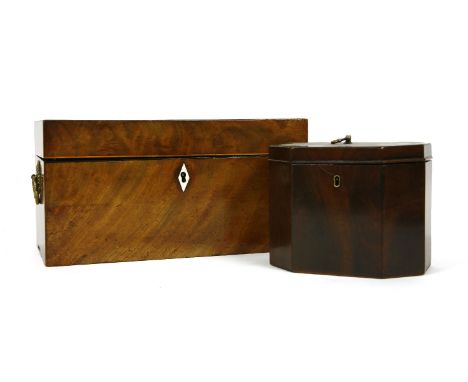 A Regency mahogany tea caddy, the interior with two lidded compartments, flanking a replacement mixing bowl, 30.5cm wide, and