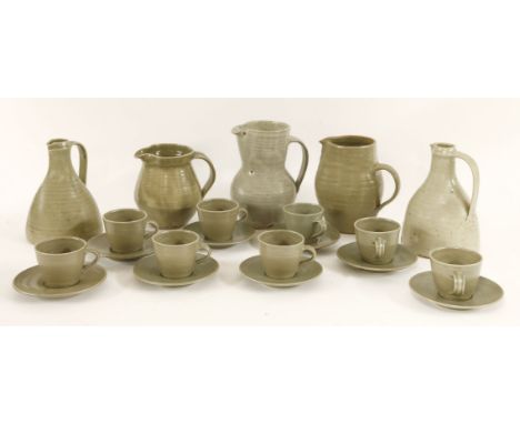 Leach Pottery, a set of eight Lowerdown Pottery cups and saucers, together with four further jugs, each with Leach Pottery ma
