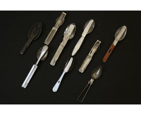 A collection of military pattern knife, fork and spoon sets, some marked U.S, one with a hinged eagle over a swastika, and ot