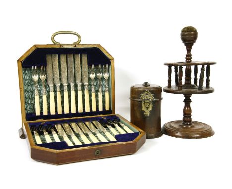 A 18th century mahogany travelling cutlery case, a Victorian reel stand, damaged, and a cased table top fruit set, missing on