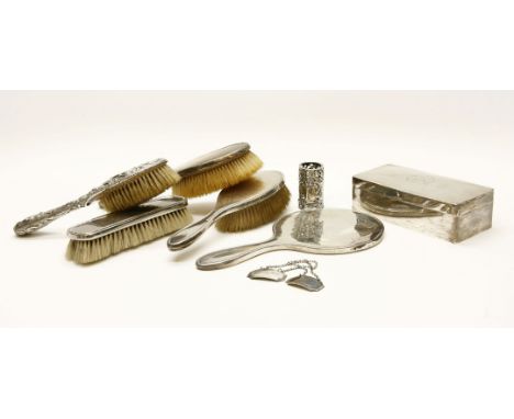 A collection of silver items, to include a part dressing table set, a silver box, decanter labels, etc