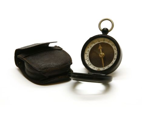 A Negretti & Zambra compass, in leather case