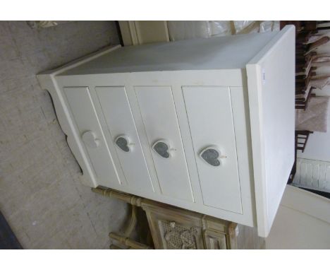 A modern white painted four drawer dressing chest, raised on bracket feet  35''h  22''w          BSR