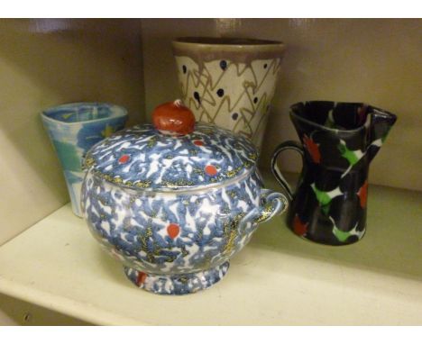 Janice Tchalenko pottery, viz. two vases; a pinched spout jug; and a twin handled pot with a lid, decorated in abstract desig