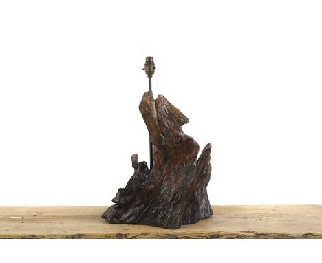 A bog oak lamp base, mounted with a brass shaft, 47cm highCondition ReportRewired, PAT tested Passed. 09-23. With a felt unde