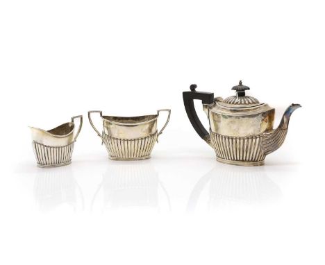 A Victorian silver three piece bachelor’s tea service, by James Dixon &amp; Son, Sheffield 1894, comprising a teapot, 18.5cm 