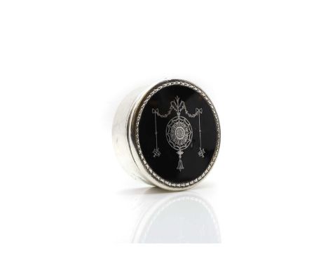 A silver and tortoiseshell box William Comyns, London, 1907, of circular form, with Classical stye piquework decoration,11cm 