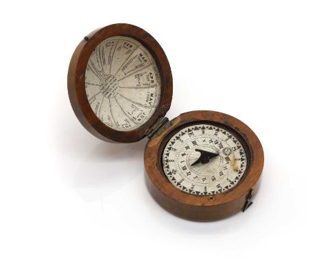 A treen magnetic sun dial compass,  early to mid 19th century, the interior with a paper label, 5.5cm diameterProvenance: The