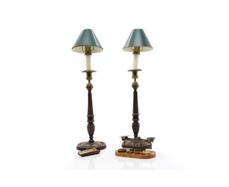 A pair of George III style mahogany candlestick lamps c.1900, with turned reeded base with brass sconce and drip pan and gree