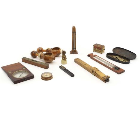 A collection of treen items,  comprising, a pair of maple and bone nutcrackers, mid-19th century, possibly French, with a scr