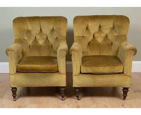 A pair of Victorian armchairs with yellow Draylon upholstery, button upholstered back and turned tapering front legs terminat