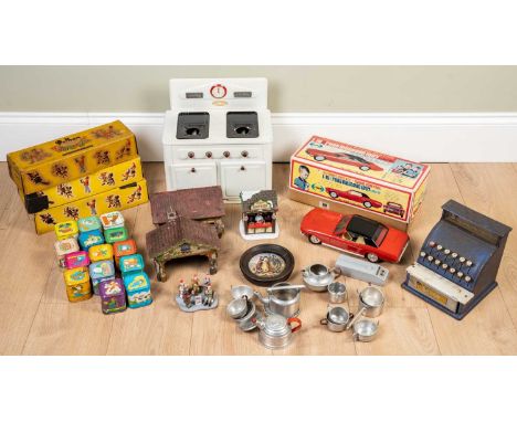 An Amersham tin plate toy cooker together with a group of matching saucepans and kettles, solid fuel tablets etc, a Merit tin