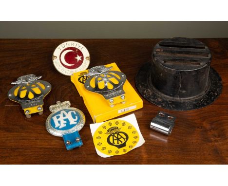 Motoring ephemera consisting of a Cyprus C964 AA badge; a Rhodesia R73607 AA badge in possibly original box; a Turkish car ba