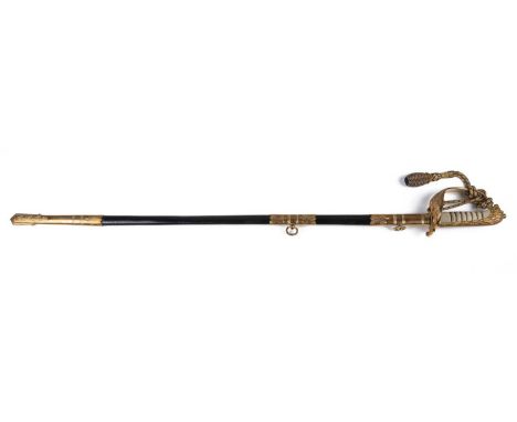 A naval dress sword with brass and leather scabbard and original canvas case, 95cm longSome slight tarnishing to the blade an