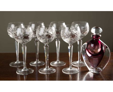 A set of seven Hock glasses with cut glass bowls on facetted stems 18.5cm high, together with an art glass flask and stopper,