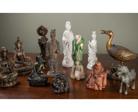 A collection of Asian deities and figurines to include bronze, terracotta and porcelain examples, the largest 28cm highOne fi