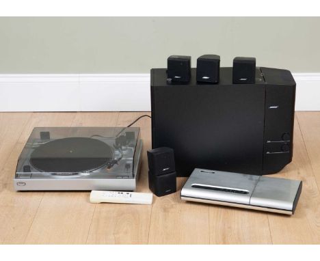 A group of Bose stereo equipment consisting of a Lifestyle Model 5 Music Centre, five small speakers and a bass speakerSold a