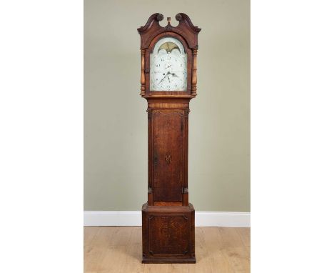 A George III oak longcase clock the hood with break arch pediment, the arching dial with moon phase, Arabic numerals, date in