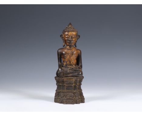 Khmer-style bronze figure of Buddha, 19th century or earlier, seated with his right hand in bhumisparsamudra on a stepped bas
