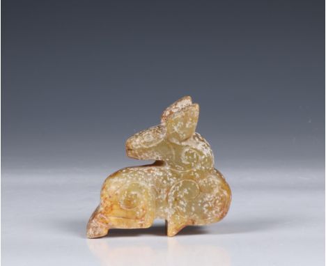 China, stone 'animal' carving, carved with large ears and looking over its back (stone mottled and worn) l. 6 cm [1]