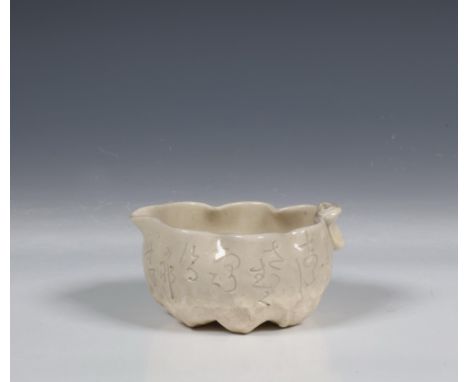 Japan, glazed earthenware washer, by Otagaki Rengetsu (1791-1875), shaped as a leaf with ruyi-shaped handle, the sides incise
