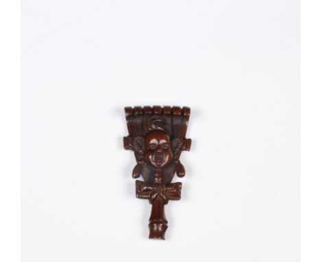 Japan, boxwood netsuke, 19th/ 20th century, carved as a mask on a broom, signed h. 7,5 cm Provenace: from the collection of f