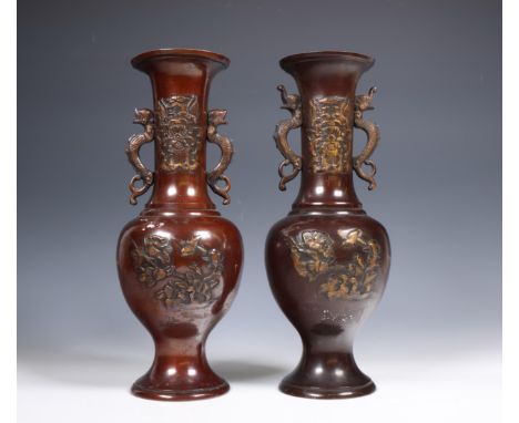Japan, pair of bronze vases, 20th century, modelled in relief with birds and flowers, the long necks applied with twin dragon