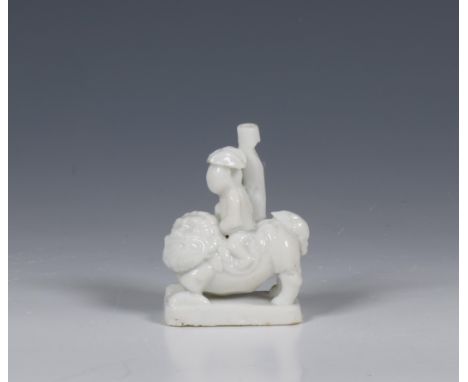 China, blanc-de-chine 'Dutchman' whistle, Kangxi period (1662-1722), depicting a Dutchman seated on a lion (minute frits and 