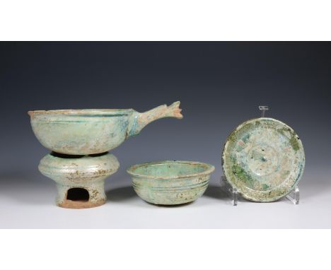 China, green-glazed pottery water-ladle and a stove on burner, Han dynasty (206 BC- 220 AD), the ladle modelled with handle, 