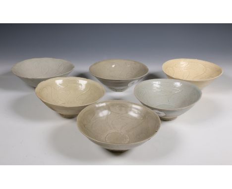 China, set of six celadon-glazed bowls, Northern Song dynasty, 10th-12th century, each with incised flowing decoration and co