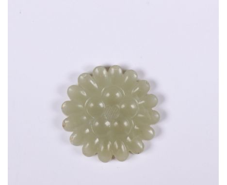 China, celadon jade 'chrysanthemum' carving, carved as a flower-head (some chips) diam. 4,4 [1]