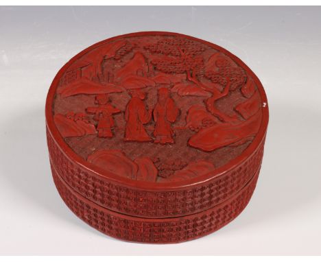 China, circular cinnabar lacquer box and cover, Qing dynasty (1644-1912), carved in relief with scholars in a landscape, the 