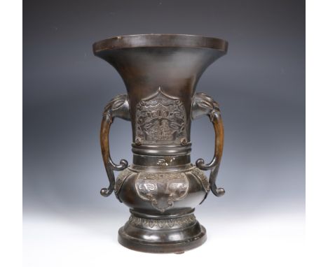 Japan, bronze vase, 19th/ 20th century, with bulbous lower half and flared neck moulded in relief with taotie panels, applied