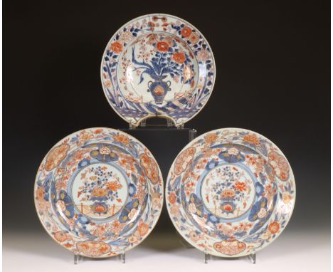 Japan, pair of Imari porcelain dishes and a shaving basin, 18th century, each decorated with flowers (shaving basin broken an