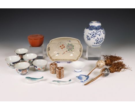 Japan, collection of porcelain, lacquerware and artefacts, 18th century and later, comprising a set of five Imari cups, a sha