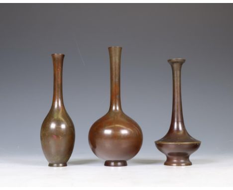 Japan, three small bronze vases, Meiji period (1868-1912), each of various shape with slender necks h. 16-18 cm [3]