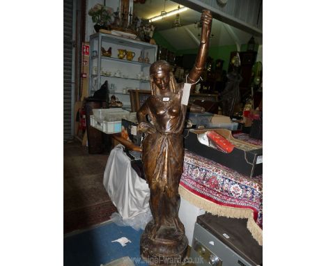 A most appealing cast metal Floor Lamp, well portraying the figure of an Egyptian woman in a diaphanous dress holding a torch