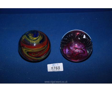 An Isle of Wight Pedestal paperweight in red, blue and yellow swirl. signature to base for Michael Harris, 3" diameter and a 