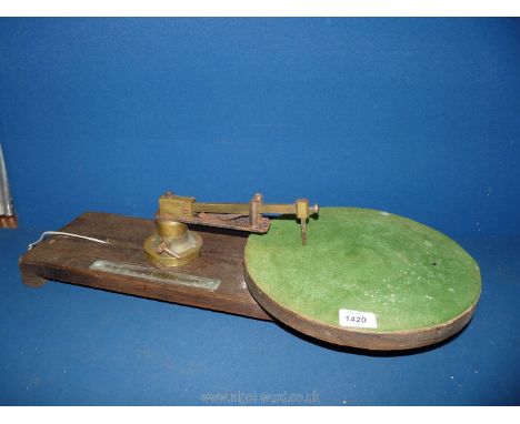 An antique Mahogany glass based cutting Turntable by "Sharratt &amp; Newth, London" having a brass diameter indicating scale,