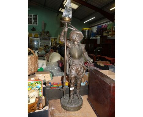 A heavy and well modelled metal Floor Lamp depicting a Cavalier in traditional dress including a broad brim hat and leaning o