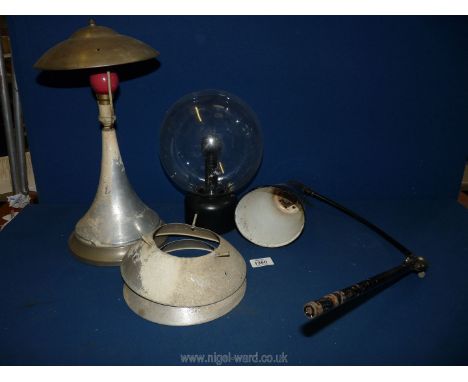 A box of light fittings, black angle poise lamp, art deco style table lamp, plastic goldfish bowl style lamp, a/f.