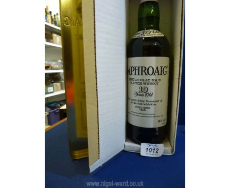 A bottle of 10 years old Laphroaig Single Malt Scotch Whisky from the Isle of Islay, in presentation tin.