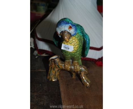 A green and blue pottery Parrot with orange glass eyes, been converted to a lamp and with repair, 11'' tall.
