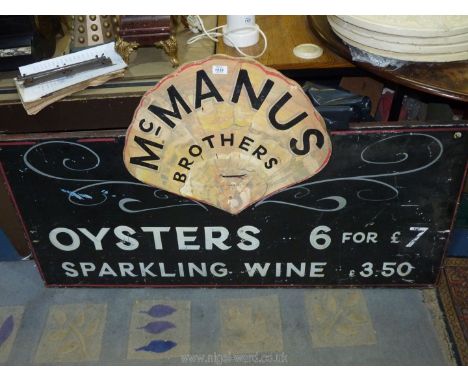 An attractive large advertising Sign for McManus Brothers listing Oysters and sparkling Wine for sale.  56" long x 32 1/2'' h