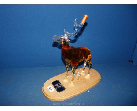A novelty decanter by Stylish Whisky in the form of a Stag (one antler a/f but present) with contents of Highland Malt Scotch