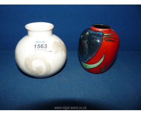 Two Poole pottery vases:  'Vermont' and the other red with blue flowers, both 4" tall.
