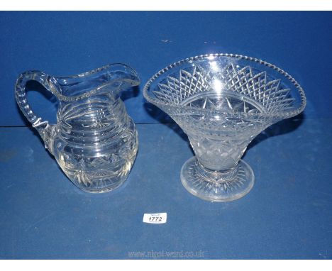 A heavy quality 19th century 4 pint glass jug having finger cut rim and handle (a/f with crack) and slice body, (9" tall) tog