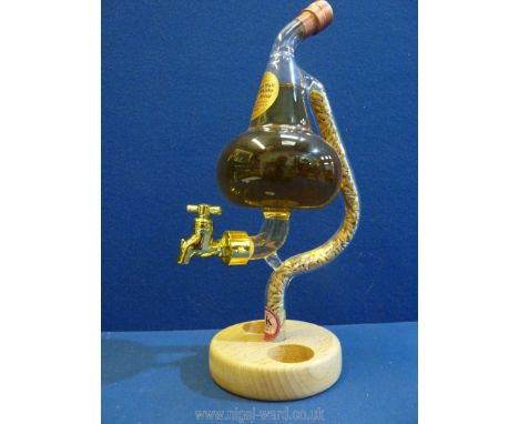 A novelty dispenser by Stylish Whisky with contents of Highland Malt Scotch Whisky, (base missing two small glasses).
