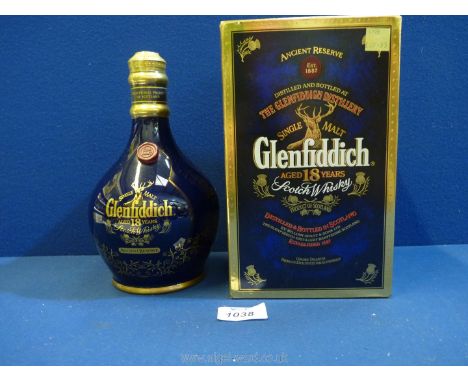 A boxed 'Single Malt Glenfiddich aged 18 years Scotch Whisky' decanter (blue box).
